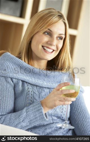 Young Woman Enjoying Glass Of Wine