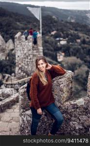 Young woman enjoying Moorish Castle in Sintra, Portugal