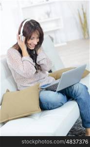 young woman enjoying music at home