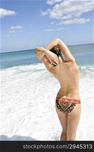 Young woman enjoying sunbath on the beach