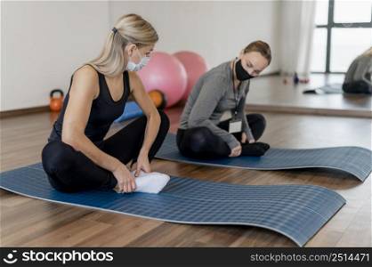 young woman exercising gym coach yoga mats
