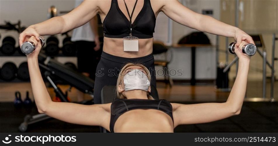 young woman exercising gym front view