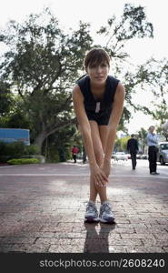 Young woman exercising with physical trainer