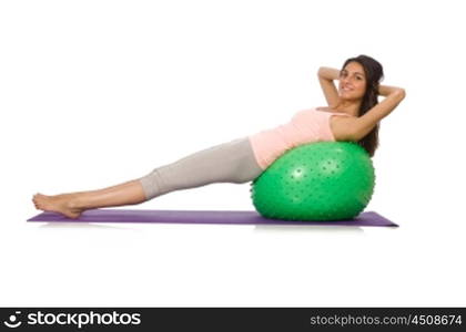 Young woman exercising with swiss ball