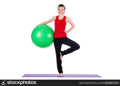 Young woman exercising with swiss ball