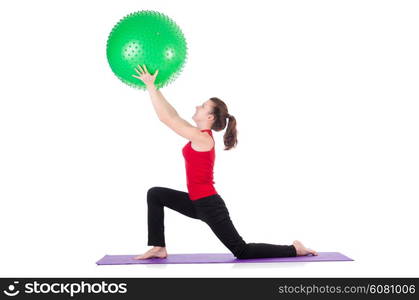 Young woman exercising with swiss ball