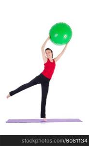 Young woman exercising with swiss ball