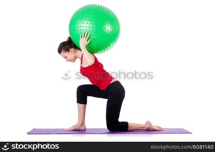 Young woman exercising with swiss ball