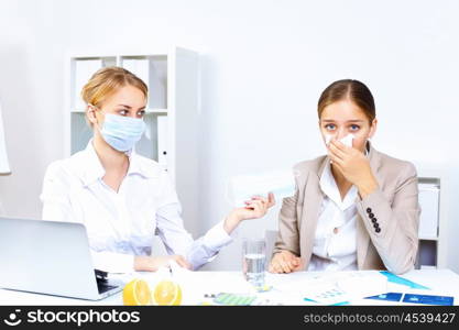 Young woman feeling unwell and sick in office