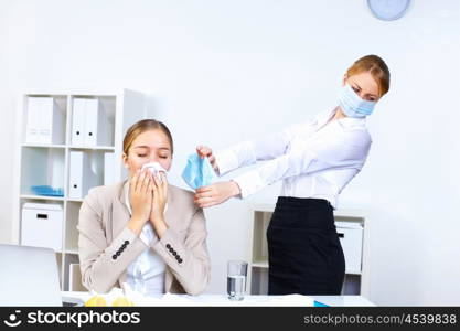 Young woman feeling unwell and sick in office