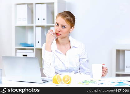 Young woman feeling unwell and sick in office