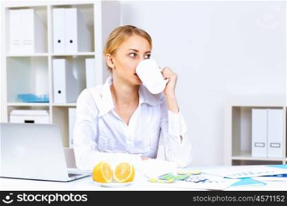 Young woman feeling unwell and sick in office