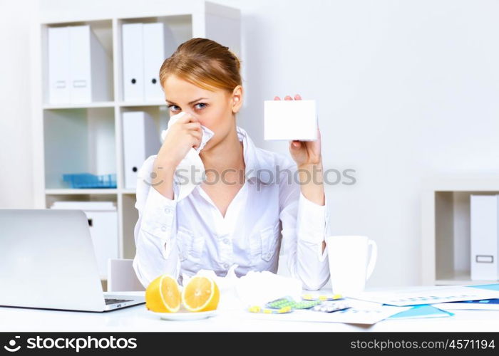 Young woman feeling unwell and sick in office