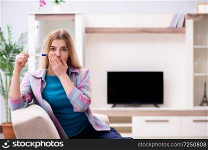 Young woman finding out about her pregnancy