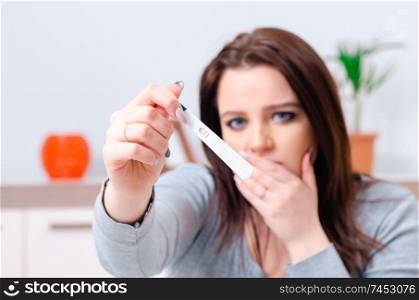 Young woman finding out about her pregnancy