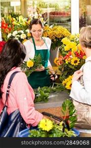 Young woman florist cutting flower shop customers retail colorful