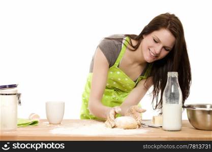 young woman forming dough with her hands. young baking woman forming dough with her hands on white background