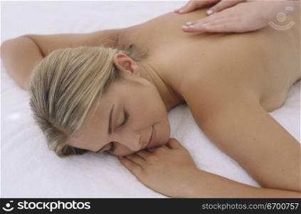Young woman getting a back massage