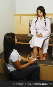 Young woman getting a pedicure