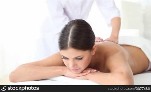 Young woman getting massage at spa session