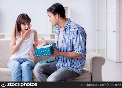 Young woman getting pet rabbit as birthday present. The young woman getting pet rabbit as birthday present