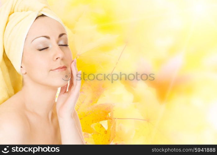 Young woman getting ready for the spa treatment on autumn background