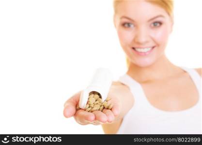 Young woman girl holding vitamins pills. Health care. Healthy lifestyle nutrition concept. Isolated on white background. . Woman girl holding vitamins pills. Health care.