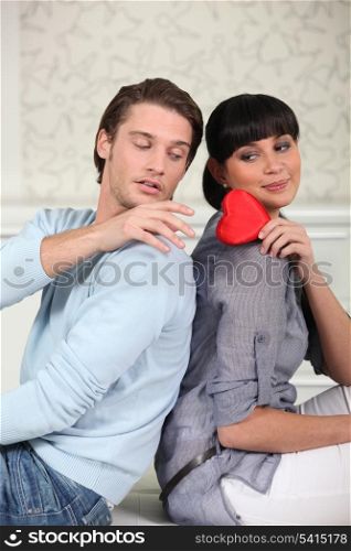 Young woman giving her heart to a man