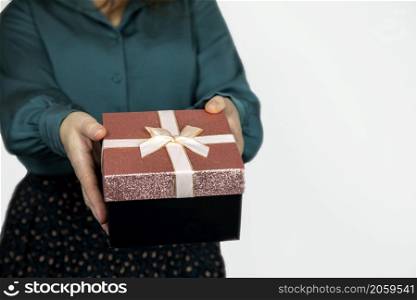 Young woman giving sparkling gift box isolated on white background, Female,Valentines Day, Birthday,Mothers Day and present concept copy space space for text. Young woman giving sparkling gift box isolated on white background, Female,Valentines Day, Birthday,Mothers Day and present concept copy space