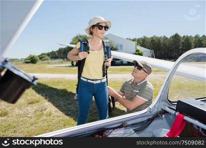 young woman going on board a glider