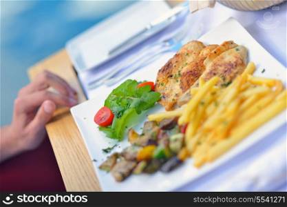 young woman have fresh healthy salad meal lunch at restaurant