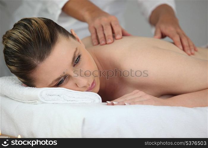 Young woman having a back massage