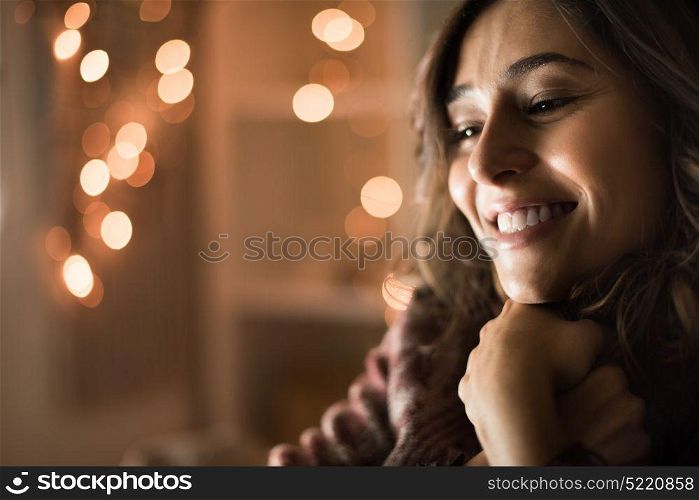 Young woman having a warm christmas time