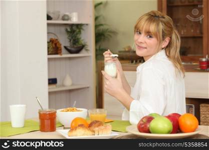 Young woman having breakfast