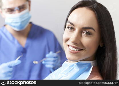 Young Woman Having Check Up And Dental Exam At Dentist