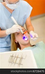 Young woman having dental surgery in stomatology clinic teeth checkup