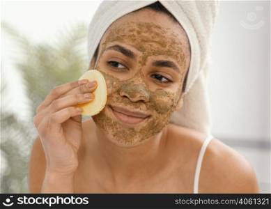 young woman having homemade mask her face 4
