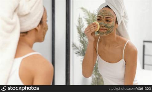 young woman having homemade mask her face 5