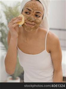 young woman having homemade mask her face 6