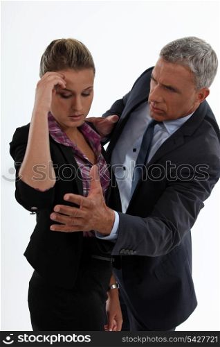 young woman having migraine comforted by mature gentleman