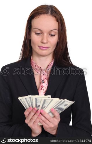 young woman holding a 100 dollar bill