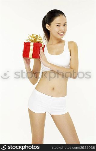 Young woman holding a gift box