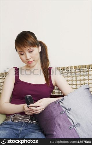 Young woman holding a mobile phone