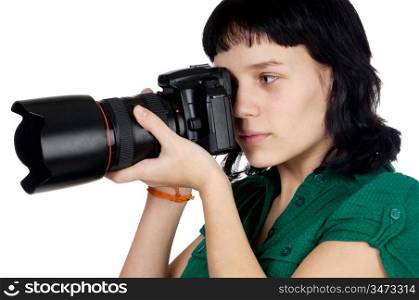 Young woman holding a photo camera a over white background