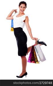 young woman holding a shopping bag on isolated background
