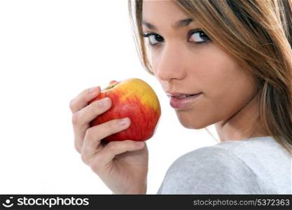 young woman holding an apple