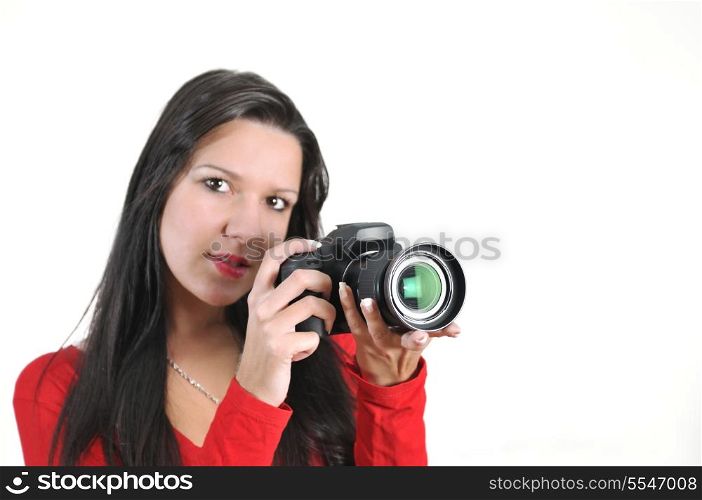 Young woman holding camera in hand taking picture isolated