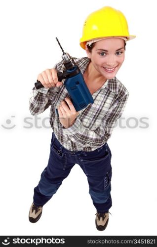 Young woman holding drill