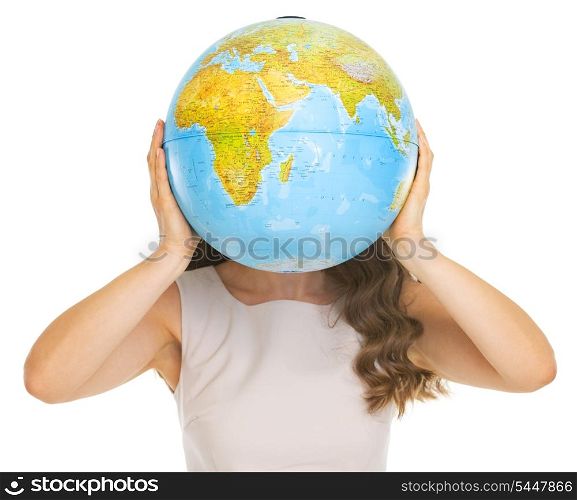 Young woman holding earth globe in front of face
