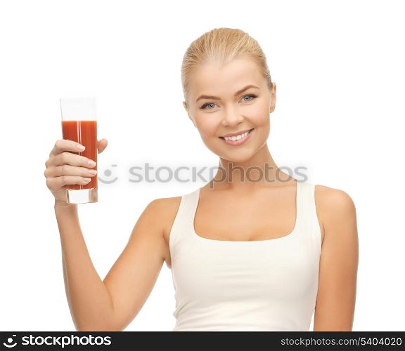 young woman holding glass of tomato juice